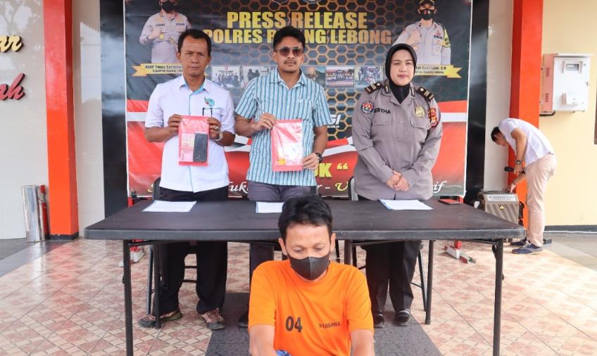 Terduga pelaku (Kaos Orange)